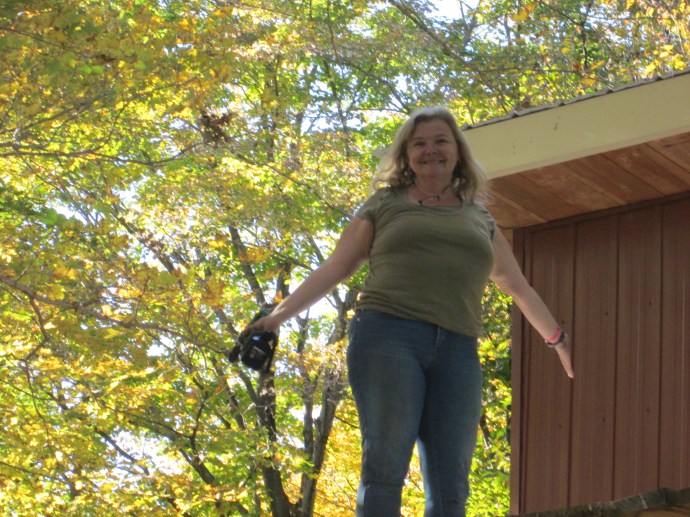 Laura hanging on the roof doing nothing