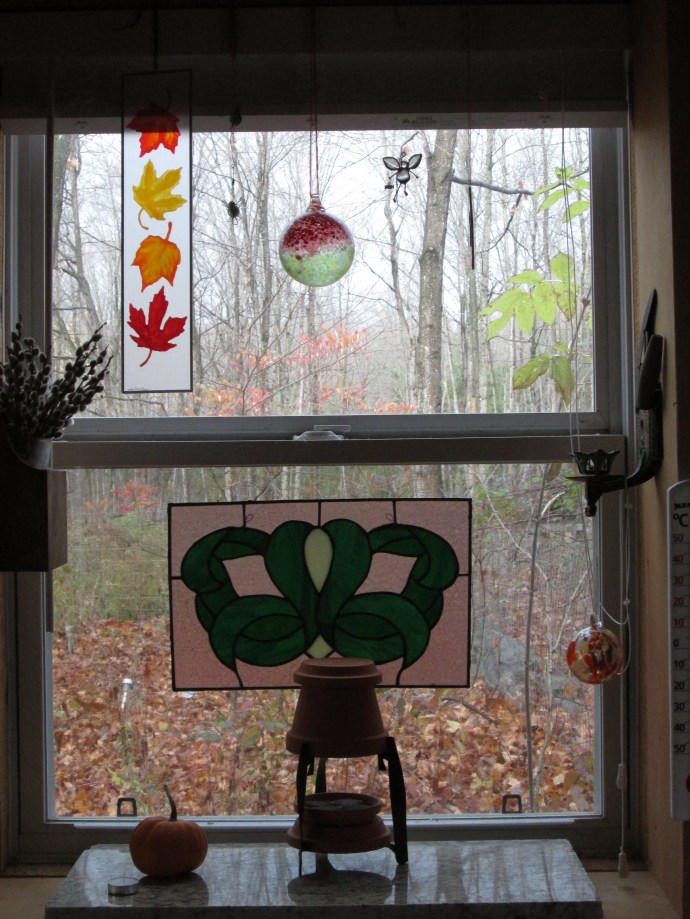 The West Window is the most decorated in THO. also it is where I put things like the little flower pot heater and candles and even the small propane heater from time to time.  Recently, my son did a dumpster dive for me at the countertop manufacturer and got this great piece of 1.5 inch thick marble so now the window sill won't get damaged by damp and wax.  